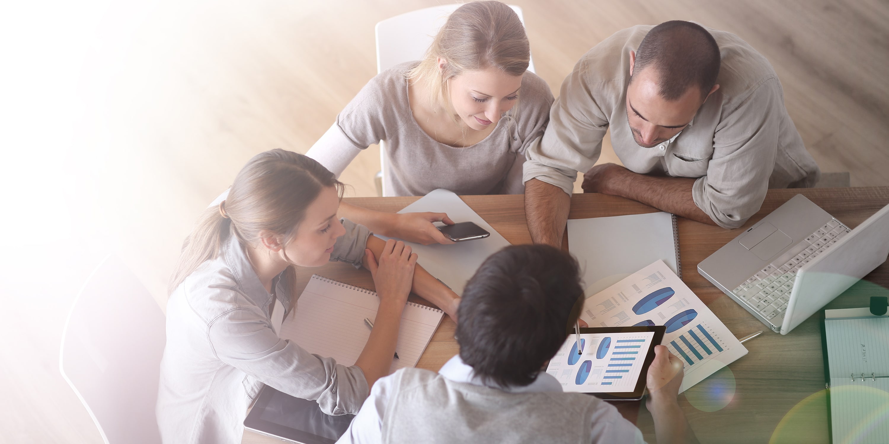 a team of four people discussing organizational mapping