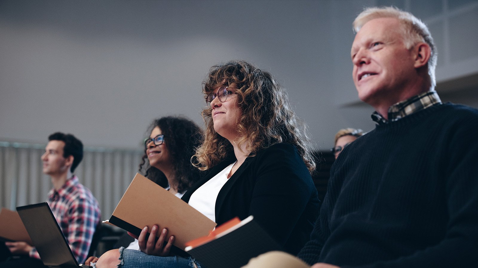 people attending a talk on public sector transformation