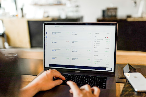a person on a computer looking up iaas vs paas vs saas