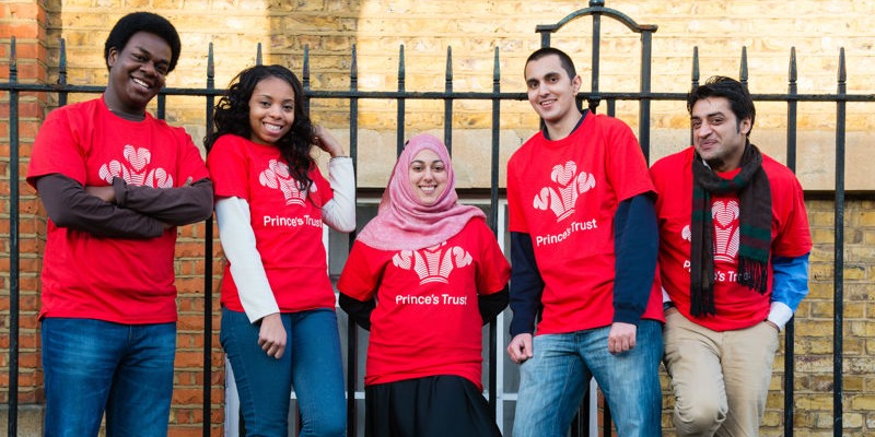 a group of five youth from the prince's trust in red tshirts