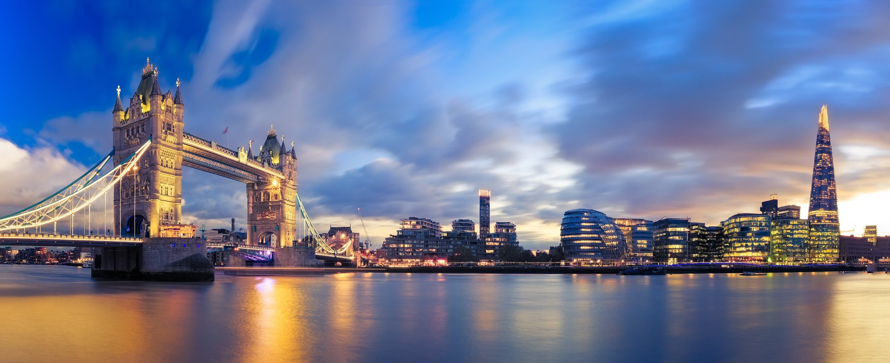 image of the london skyline with london city hall and tower bridget in the foreground