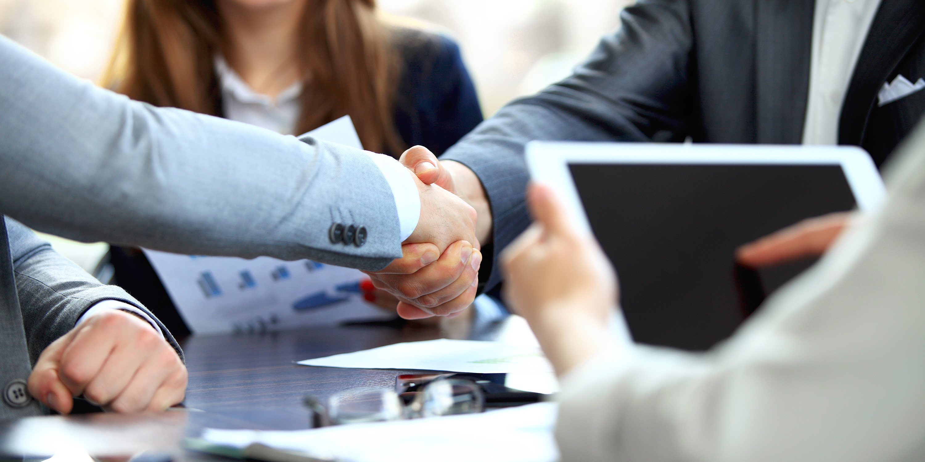 Shaking hands to agree partnership for driving enterprise management